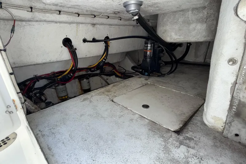 Slide: The Image of Engine compartment of 2021 Marlin 39 CC boat, showing wiring and mechanical components. - 78