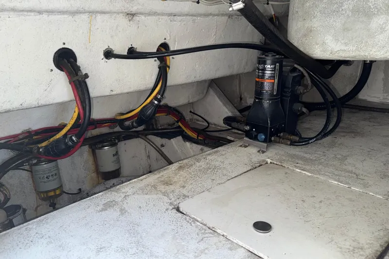 Slide: The Image of Engine compartment of 2021 Marlin 39 CC boat with hydraulic system and wiring. - 79