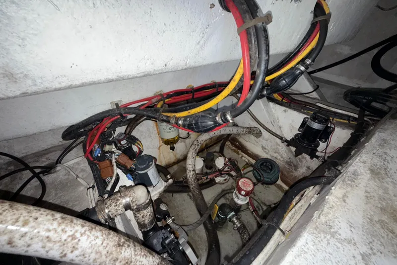 Slide: The Image of Engine compartment of a 2021 Marlin 39 CC boat with visible wiring and components. - 80