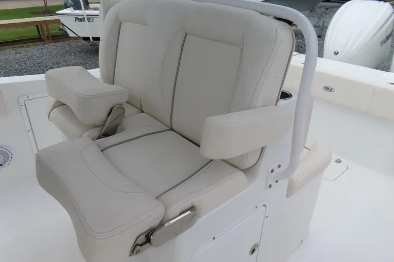 Slide: The Image of 2024 Sea Hunt Gamefish 30 Coffin Box boat seat with cushioned armrests. - 19