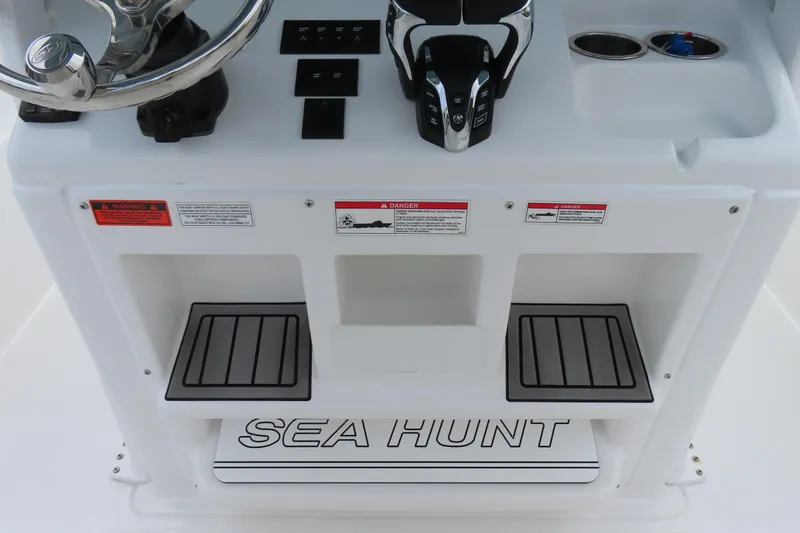Slide: The Image of 2024 Sea Hunt Gamefish 30 Coffin Box console with steering wheel and controls. - 22