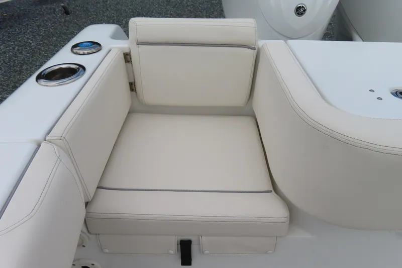 Slide: The Image of 2024 Sea Hunt Gamefish 30 Coffin Box boat seat with cup holders and white upholstery. - 29