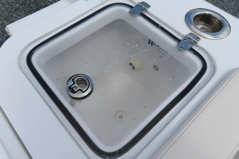 Slide: The Image of 2024 Sea Hunt Gamefish 30 Coffin Box livewell with secure lid and cup holder. - 32