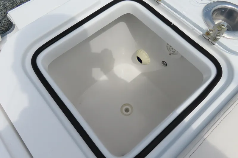 Slide: The Image of 2024 Sea Hunt Gamefish 30 Coffin Box interior detail, featuring a white compartment. - 33