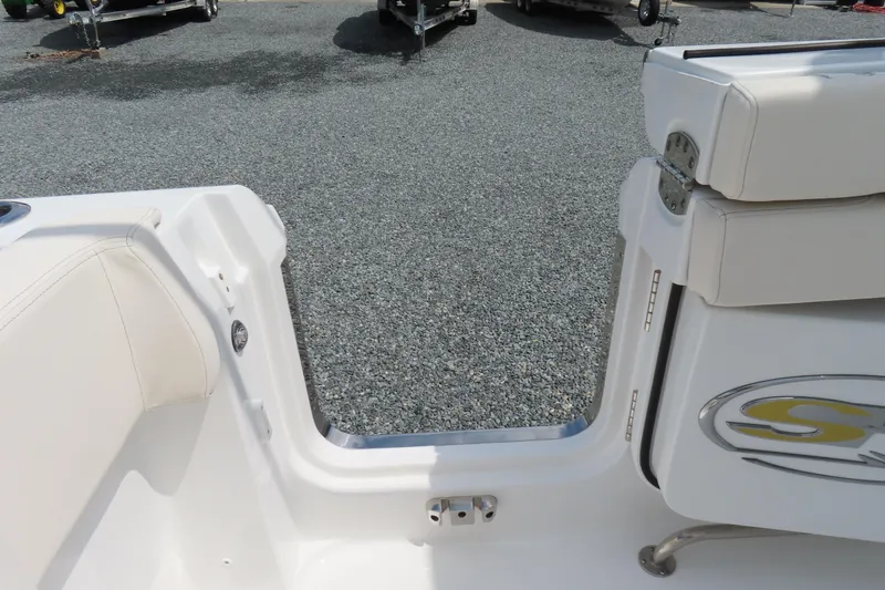 Slide: The Image of 2024 Sea Hunt Gamefish 30 Coffin Box boat interior with open transom door. - 35