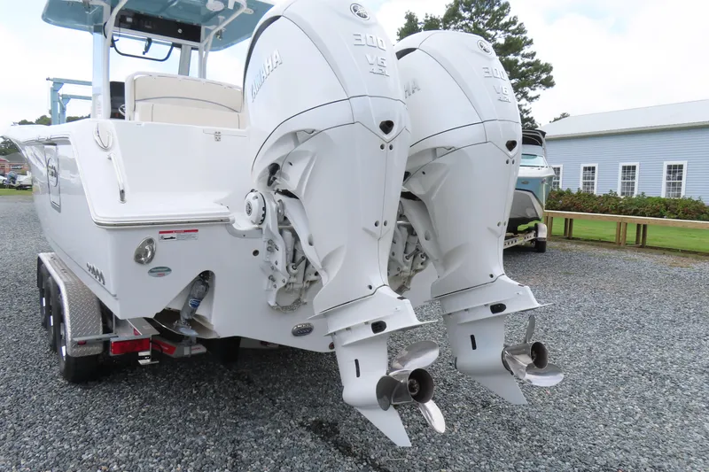 Slide: The Image of 2024 Sea Hunt Gamefish 30 Coffin Box with dual Yamaha outboard engines on a trailer. - 4