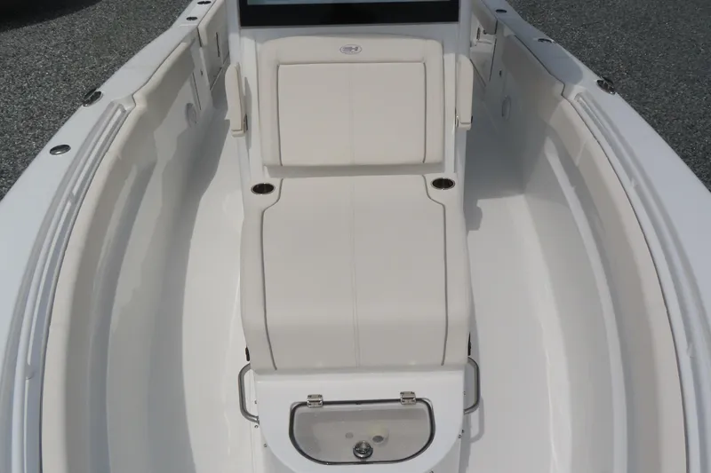 Slide: The Image of 2024 Sea Hunt Gamefish 30 Coffin Box boat interior with white seating and storage. - 8