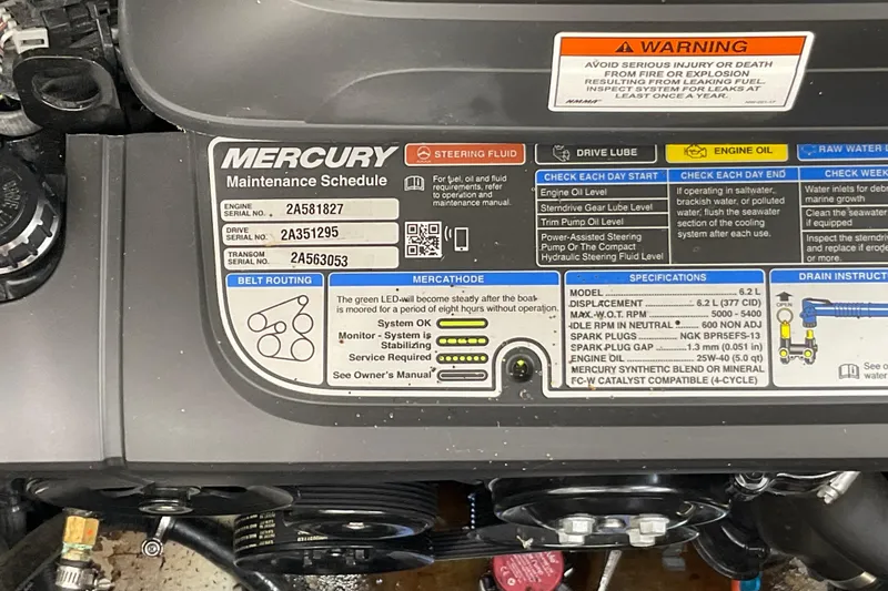 Slide: The Image of 2018 Crownline 264 CR engine maintenance schedule and specifications label. - 10