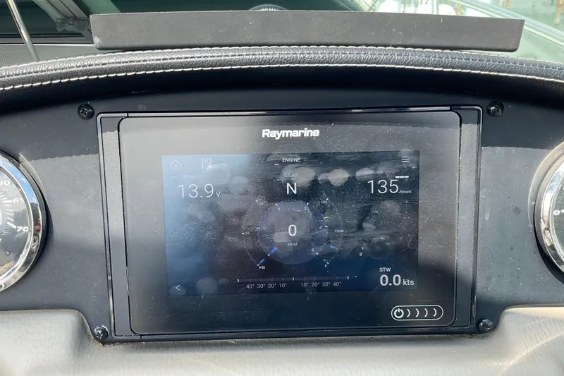 Slide: The Image of Dashboard of 2018 Crownline 264 CR boat with Raymarine display showing engine data. - 11