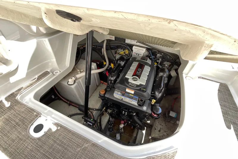 Slide: The Image of 2018 Crownline 264 CR engine compartment with 6.2L engine, showcasing clean and organized layout. - 12