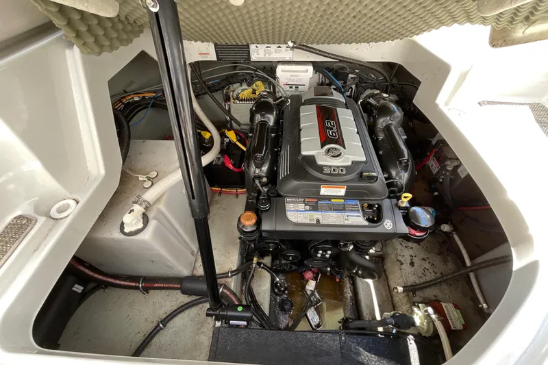Slide: The Image of Engine compartment of a 2018 Crownline 264 CR boat, featuring a Mercury 6.2L engine. - 13