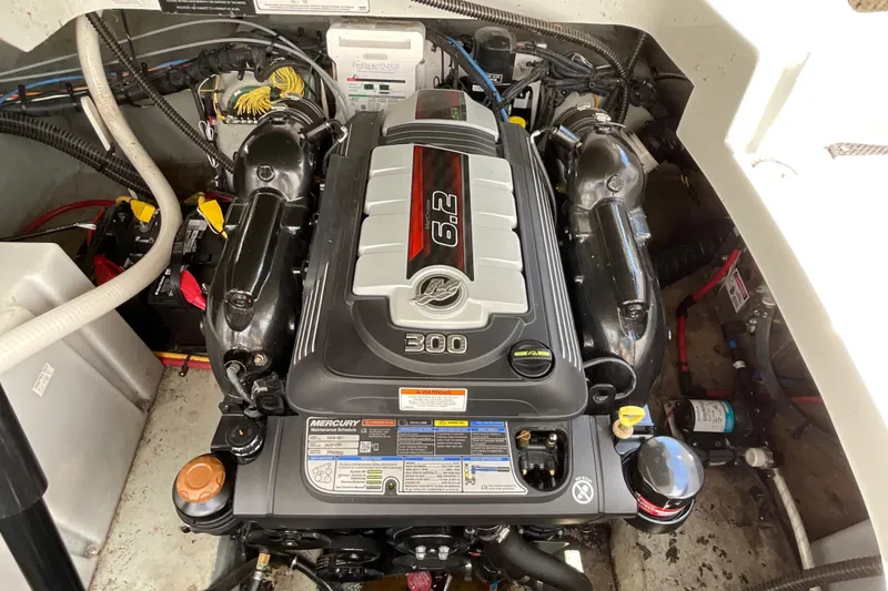Slide: The Image of Engine compartment of a 2018 Crownline 264 CR boat, featuring a Mercury 6.2L engine. - 14