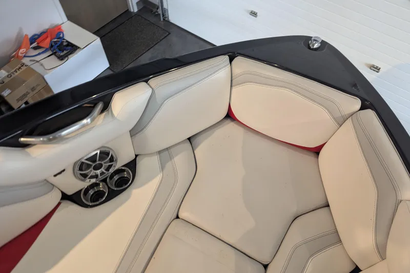Slide: The Image of Interior of 2018 Axis T23 boat with beige seating and speaker system. - 19