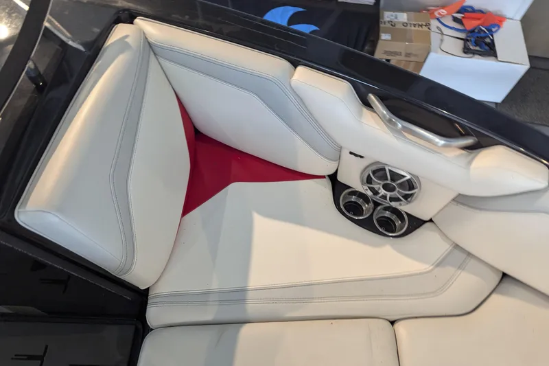 Slide: The Image of Interior of 2018 Axis T23 boat with white seating and speaker system. - 20