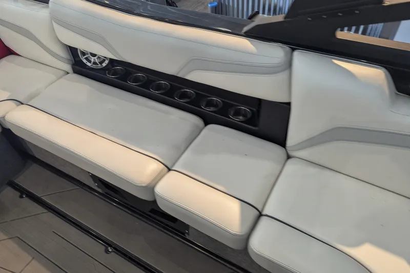 Slide: The Image of 2018 Axis T23 boat interior with white seating and built-in cup holders. - 28