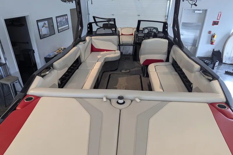 Slide: The Image of 2018 Axis T23 boat interior with spacious seating and modern dashboard. - 32