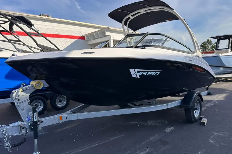 The Image of 2025 Yamaha Boats AR190 on trailer, sleek design, parked outdoors. - 0