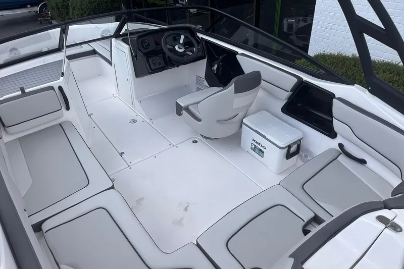 Slide: The Image of 2025 Yamaha Boats AR190 interior with seating and steering console. - 11
