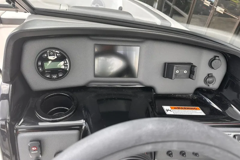 Slide: The Image of Dashboard of 2025 Yamaha Boats AR190 with control panel and display screen. - 14