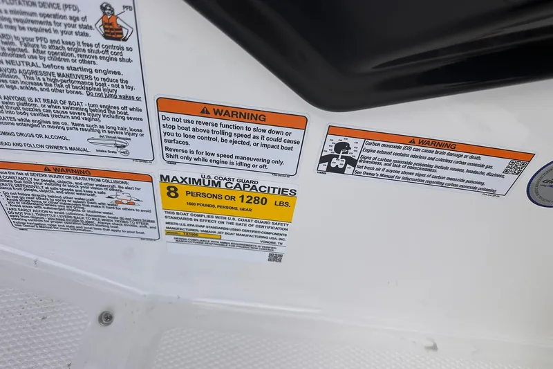 Slide: The Image of Warning labels on 2025 Yamaha Boats AR190, indicating maximum capacity of 8 persons or 1280 lbs. - 15