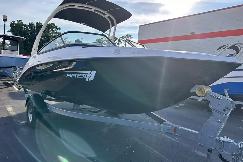 Slide: The Image of 2025 Yamaha Boats AR190 on trailer, displayed outdoors in sunlight. - 2