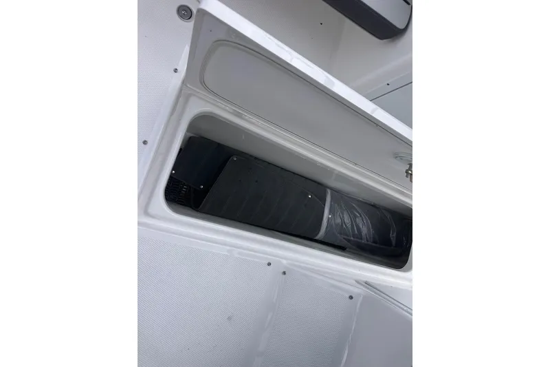 Slide: The Image of Open storage compartment in 2025 Yamaha Boats AR190. - 20