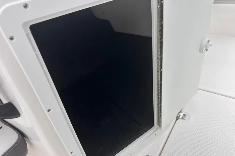 Slide: The Image of Open storage compartment on 2025 Yamaha Boats AR190, showcasing interior space. - 22