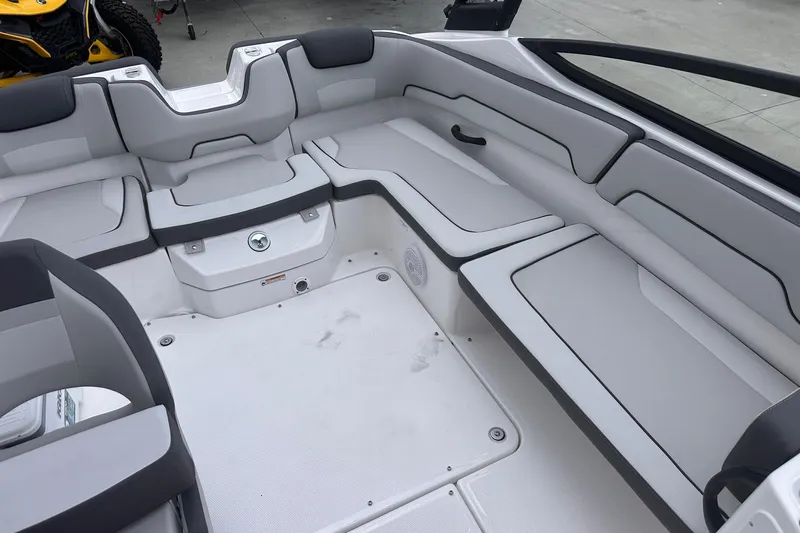 Slide: The Image of 2025 Yamaha Boats AR190 interior with sleek, modern seating and spacious layout. - 27