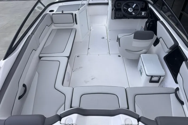 Slide: The Image of 2025 Yamaha Boats AR190 interior with spacious seating and modern helm design. - 9