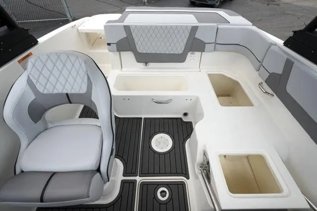 Slide: The Image of 2024 Bayliner VR5 Bowrider I/O interior with gray seating and storage compartments. - 16
