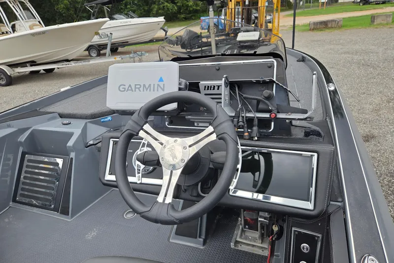 Slide: The Image of 2022 Ranger Z520R boat dashboard with Garmin navigation system and steering wheel. - 10