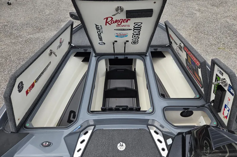 Slide: The Image of 2022 Ranger Z520R boat storage compartments open, showcasing spacious interior and organized layout. - 13