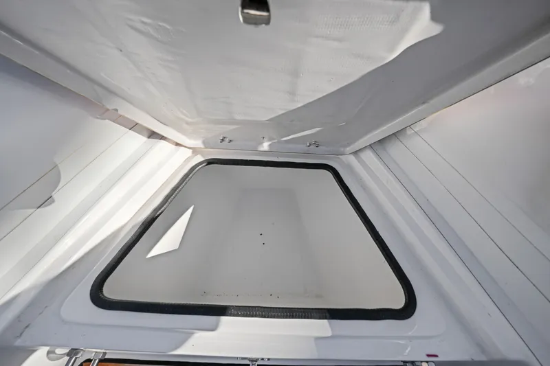 Slide: The Image of Open storage compartment in 2023 Trident 21 rib boat. - 13