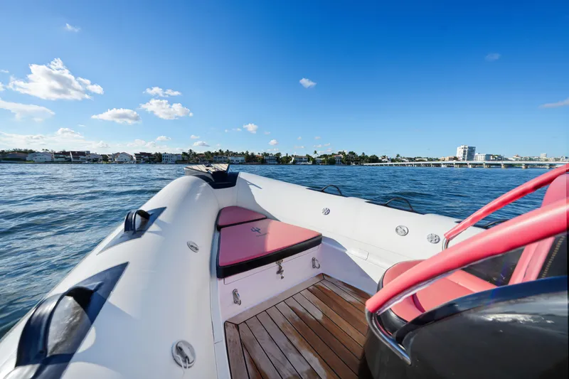 Slide: The Image of 2023 Trident 21 RIB boat on water, featuring sleek design and comfortable seating. - 6