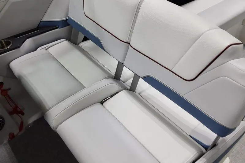 Slide: The Image of 2024 Formula 310 Sun Sport boat interior with white and blue seating. - 15