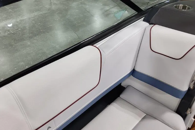 Slide: The Image of 2024 Formula 310 Sun Sport interior with white and blue seating, red accents. - 16