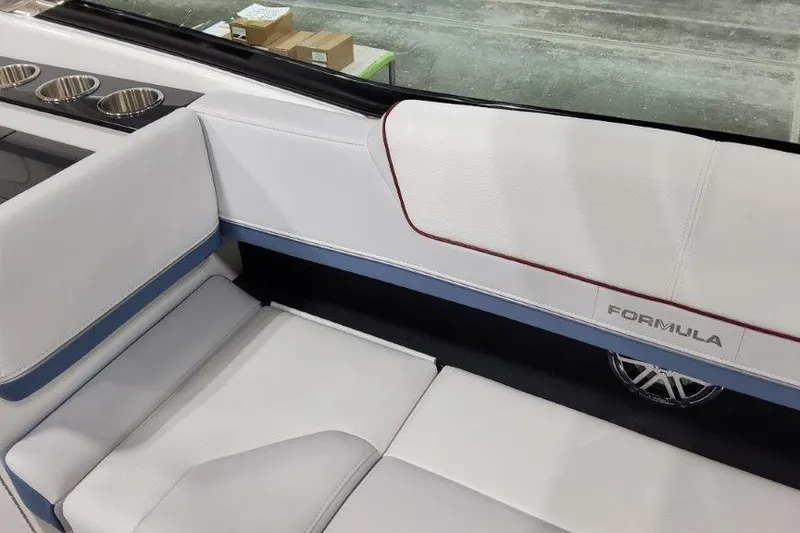 Slide: The Image of 2024 Formula 310 Sun Sport boat interior with white seating and cup holders. - 17