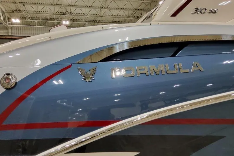 Slide: The Image of 2024 Formula 310 Sun Sport boat with sleek design and metallic logo. - 21