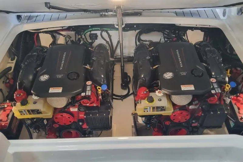 Slide: The Image of 2024 Formula 310 Sun Sport engine compartment with dual Volvo Penta engines. - 31