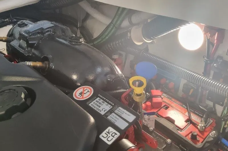 Slide: The Image of Engine compartment of 2024 Formula 310 Sun Sport boat, featuring Volvo Penta components. - 34