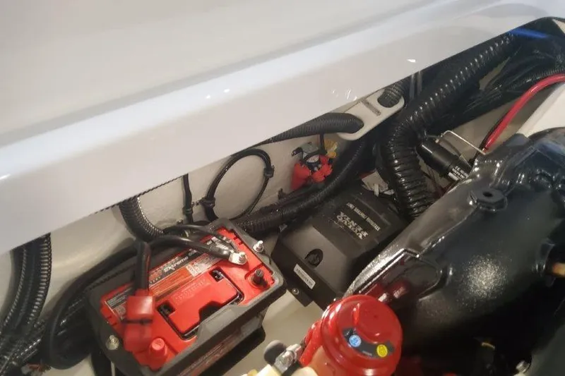 Slide: The Image of Engine compartment of 2024 Formula 310 Sun Sport with battery and wiring details. - 36