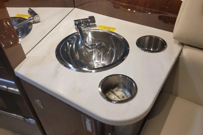 Slide: The Image of 2024 Formula 310 Sun Sport boat interior with sleek sink and countertop design. - 42