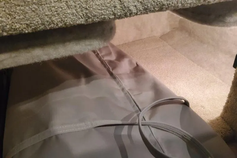 Slide: The Image of Interior view of 2024 Formula 310 Sun Sport boat cabin with carpeted flooring. - 46