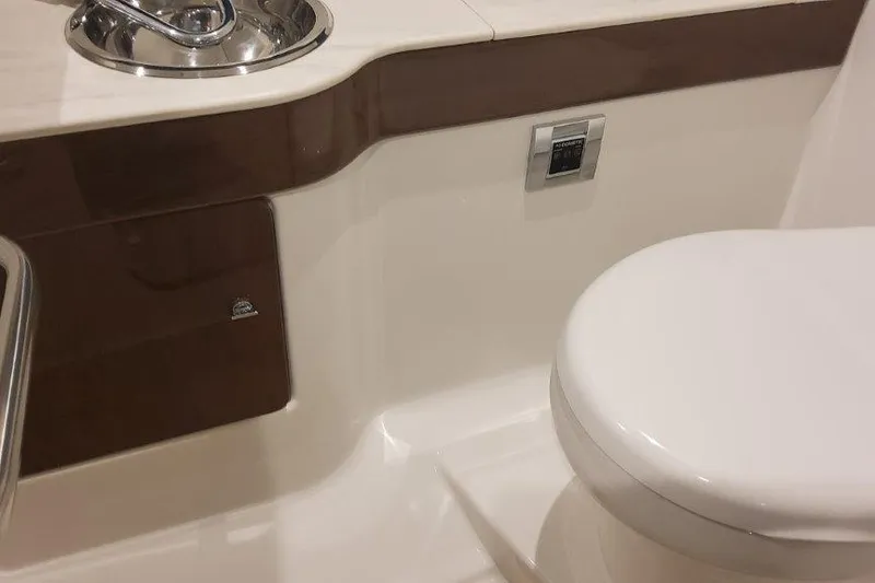 Slide: The Image of 2024 Formula 310 Sun Sport boat interior with modern bathroom amenities. - 49