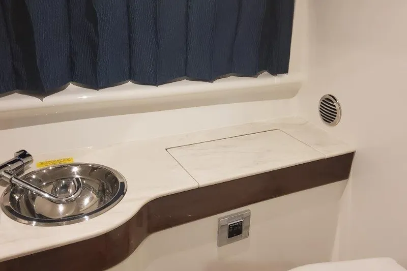 Slide: The Image of 2024 Formula 310 Sun Sport interior with sink and countertop detail. - 50