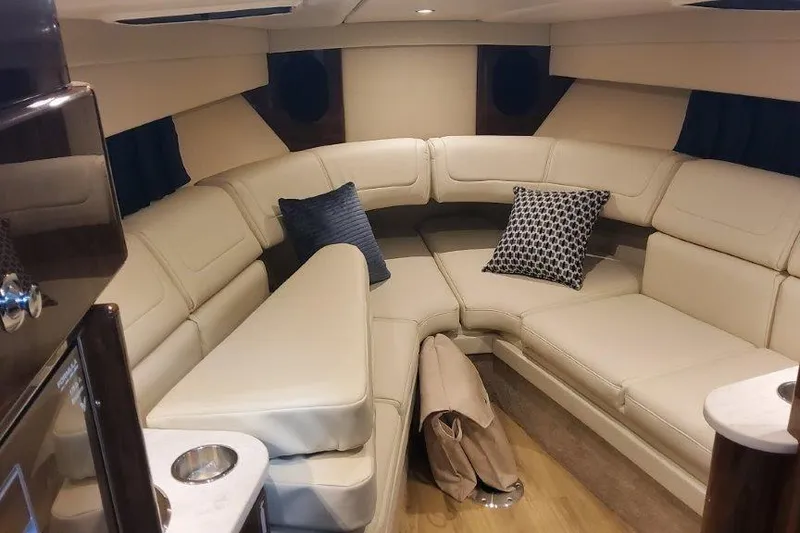 Slide: The Image of Luxurious interior of 2024 Formula 310 Sun Sport boat with plush seating and cushions. - 55