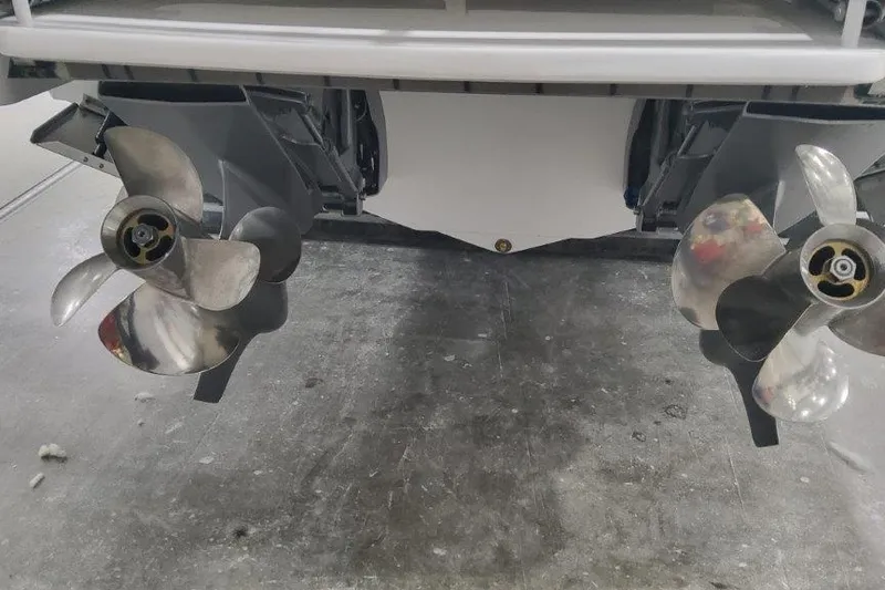 Slide: The Image of 2024 Formula 310 Sun Sport boat propellers in a garage setting. - 58