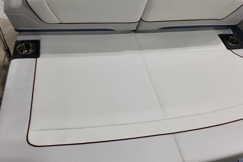 Slide: The Image of 2024 Formula 310 Sun Sport boat interior with white seating and cup holders. - 6