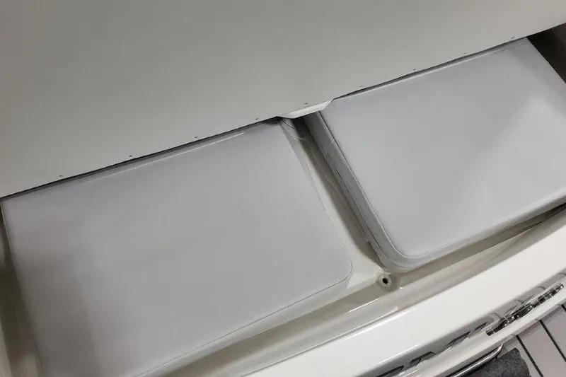 Slide: The Image of 2024 Formula 310 Sun Sport boat interior with white cushioned seating. - 8