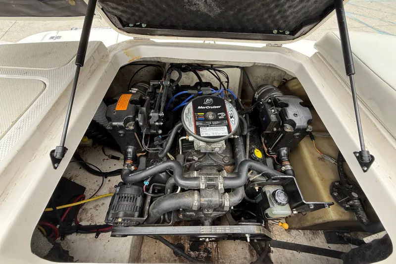 Slide: The Image of 2016 Chaparral 19 H2O Sport boat engine compartment with MerCruiser engine. - 16